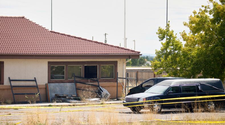 FILE - A hearse and van sit outside the Return to Nature Funeral Home in Penrose, Colo., on Oct. 6, 2023. (AP Photo/David Zalubowski, File)
