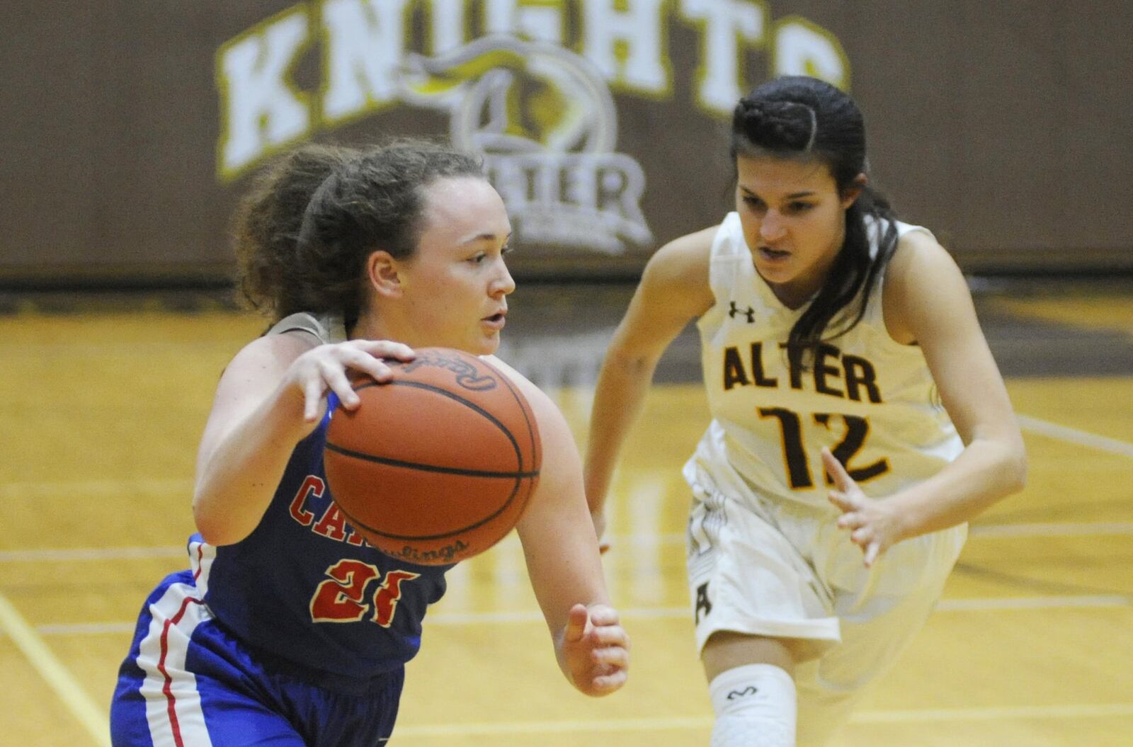 Carroll’s Meredith Schock (with ball) draws Alter’s Julia Paley. Carroll defeated host Alter 43-32 in a girls high school basketball game on Wednesday, Jan. 9, 2019. MARC PENDLETON / STAFF