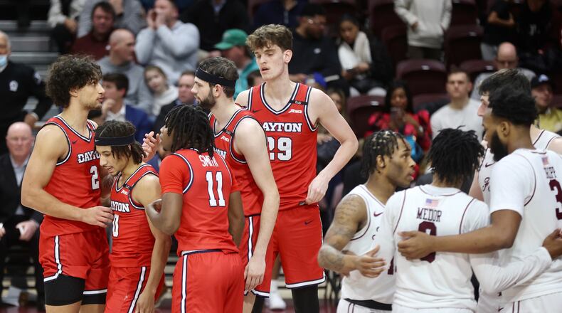 Dayton and Fordham huddle before a free throw on Wednesday, Feb. 12, 2025, at Rose Hill Gym in Bronx, N.Y. David Jablonski/Staff
