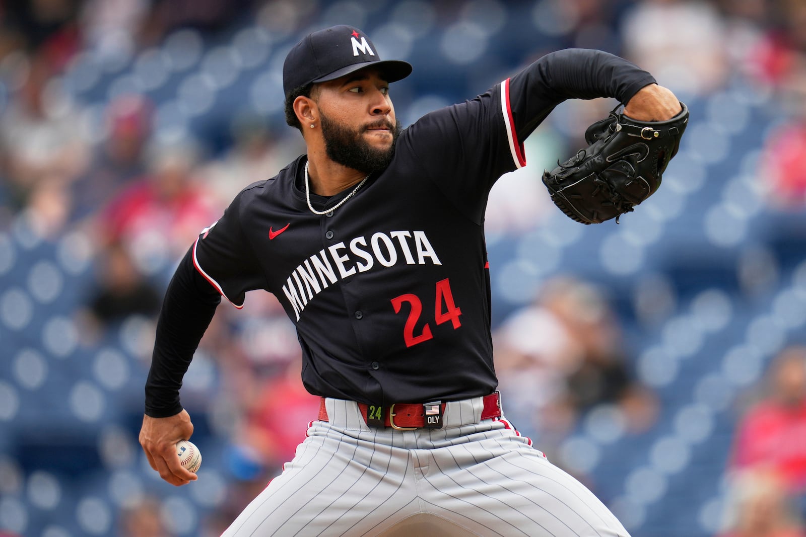 Minnesota Twins' Simeon Woods Richardson (24) pitches in the first inning of a baseball game against the Cleveland Guardians in Cleveland, Thursday, May 1, 2025. (AP Photo/Sue Ogrocki)