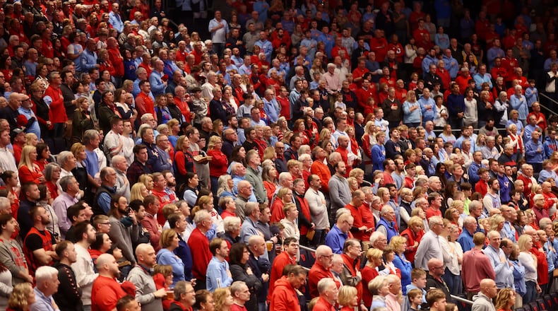 Dayton fans stand for the national anthem before a game against Saint Louis on Tuesday, March 4, 2025, at UD Arena. David Jablonski/Staff