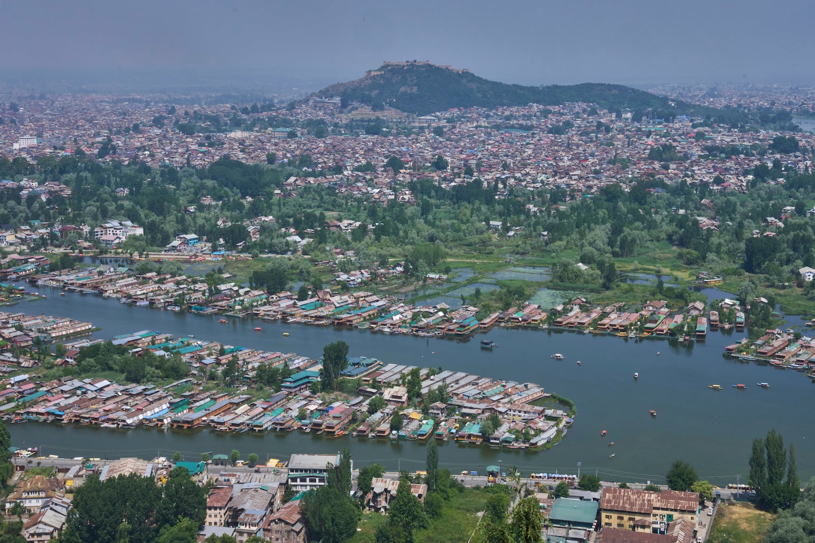 Rows of empty houseboats in Dal lake, one of the major tourist destination seen from a mountain in Srinagar, Indian controlled Kashmir, India, Tuesday, May 20, 2025. (AP Photo/Dar Yasin)