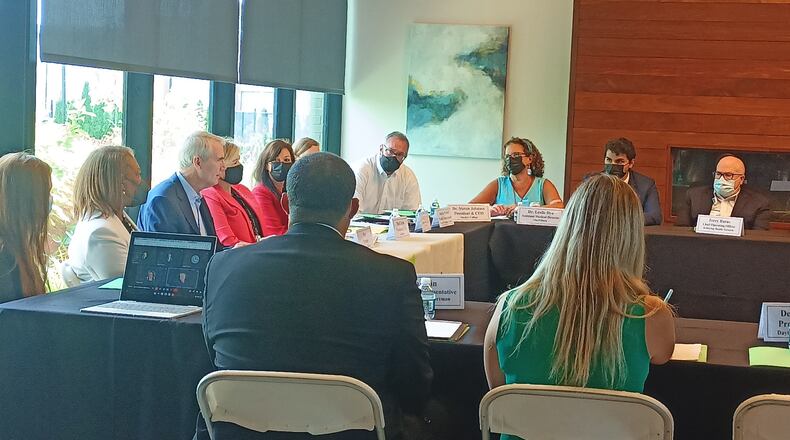 U.S. Sen. Rob Portman (R-Ohio) meets with local leaders and health care officials at OneFifteen, an outpatient addiction facility and sober living campus in Dayton,  for a roundtable discussing the opioid epidemic on Friday, July 15. SAMANTHA WILDOW\STAFF