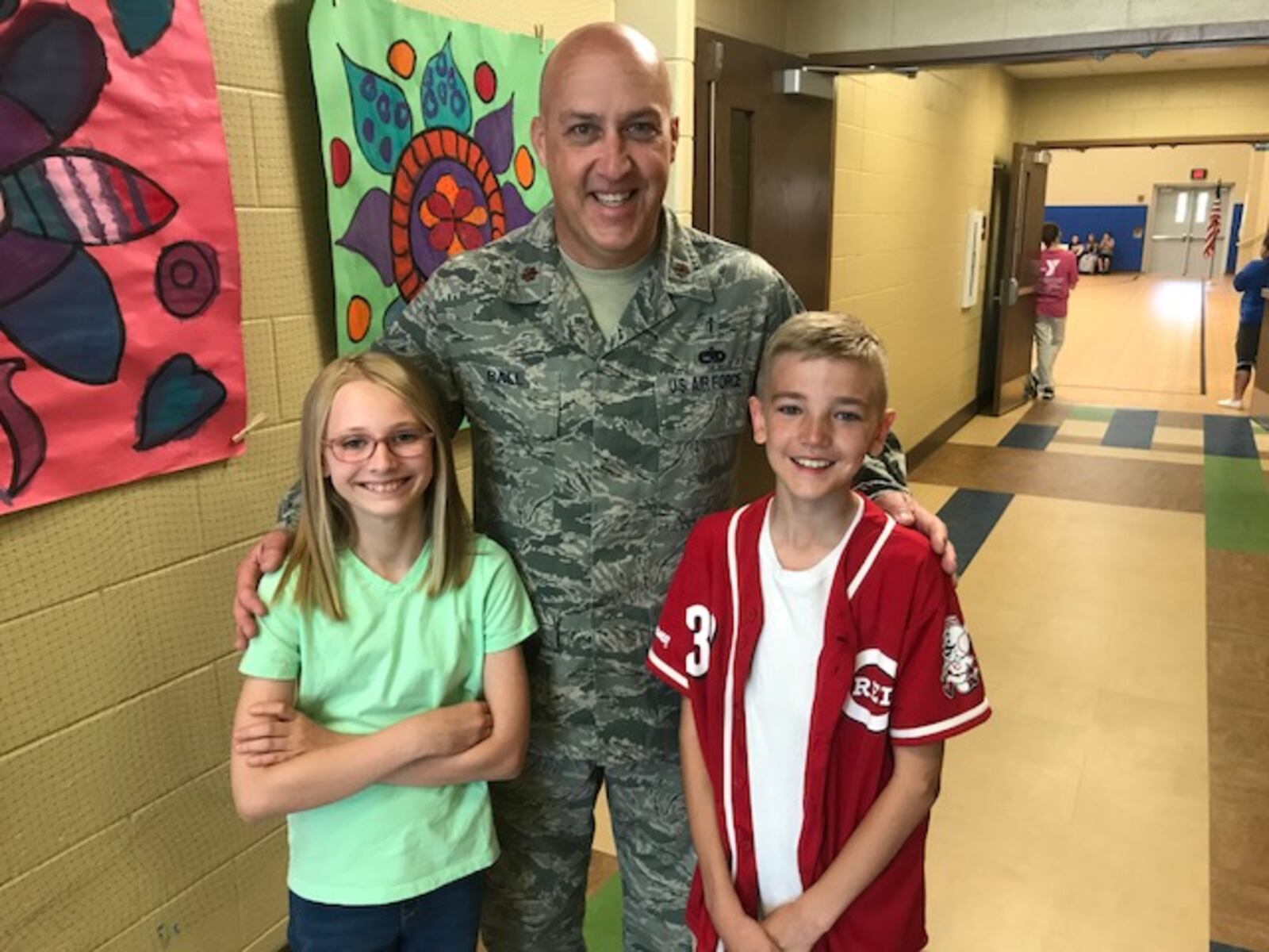 Air Force Maj. Joseph Ball with two of the McKinley Elementary students who wrote him letters while he was deployed in Iraq. Ball visited the school as a surprise to the students on Thursday, May 24, 2018. (Gabrielle Enright/Staff)