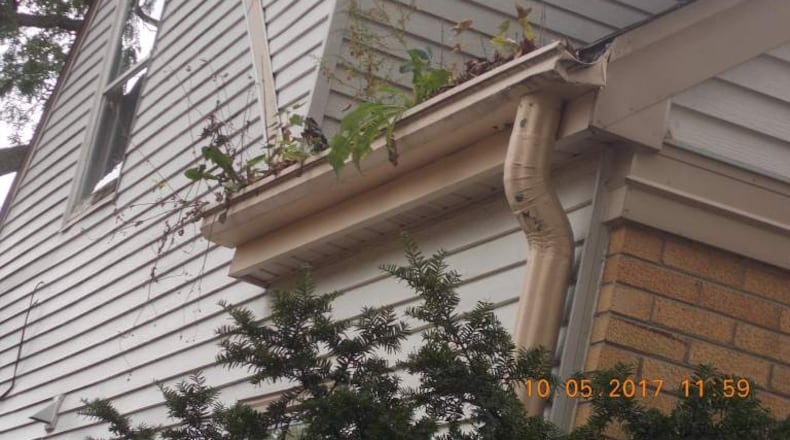 The National Fair Housing Alliance released this photo Thursday of what the alliance says is a home in Milwaukee with severely obstructed gutters. CONTRIBUTED.