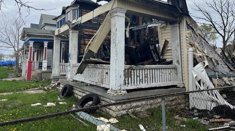 A fire destroyed this vacant home at 28 Findlay St. in East Dayton and spread to a vacant home and an occupied home next door. CORNELIUS FROLIK / STAFF