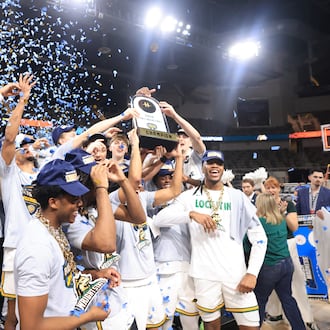 The Wright State University men's basketball team raises the trophy after beating Detroit Mercy 66-63 to win the Horizon League tournament championship on Tuesday, March 10, 2026 at the Corteva Coliseum in Indianapolis. HORIZON LEAGUE / CONTRIBUTED PHOTO