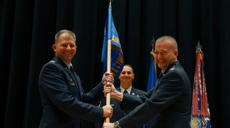 Col. William Fry, right, accepts command of the National Air and Space Intelligence Center’s Air and Cyberspace Intelligence Group from Col. Parker Wright, NASIC commander, in July 2018. (U.S. Air Force photo/ Senior Airman Jonathan Stefanko)