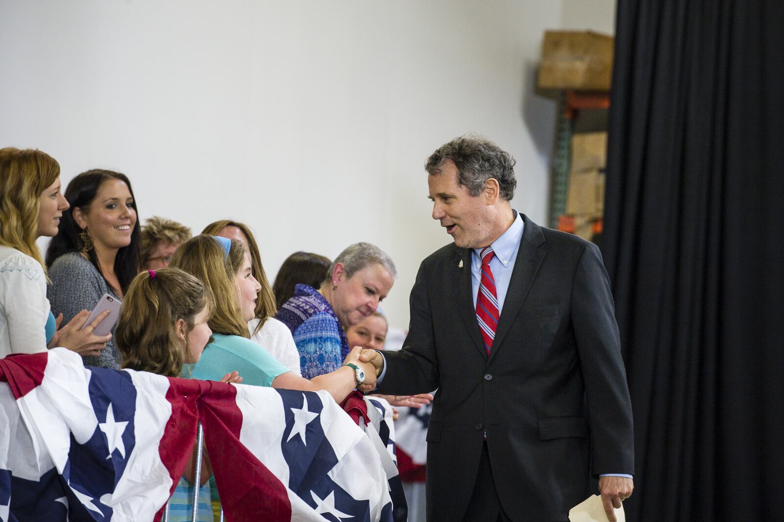CLEVELAND, OH - JUNE 13: Sen. Sherrod Brown (D-OH) shakes hands before speaking at a campaign rally for Democratic presidential candidate Hillary Clinton on June 13, 2016 in Cleveland, Ohio. In the wake of the shooting in Orlando, Florida, Clinton is campaigning in Ohio and Pennsylvania to present her vision for a stronger and safer America. (Photo by Angelo Merendino/Getty Images)