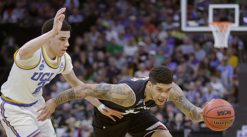 Cincinnati guard Jarron Cumberland, right, drives against UCLA Lonzo Ball during the first half of a second-round game of the NCAA men’s college basketball tournament in Sacramento, Calif., Sunday, March 19, 2017. (AP Photo/Rich Pedroncelli)