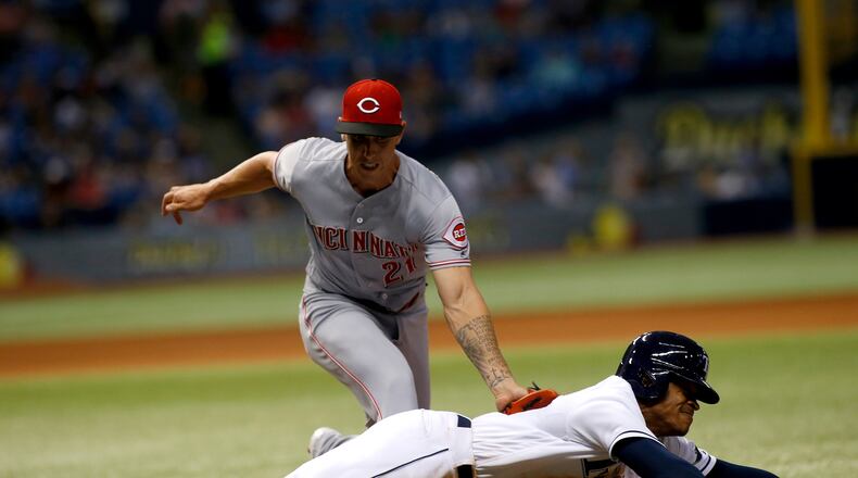 ST. PETERSBURG, FL - JUNE 19: Pitcher Michael Lorenzen #21 of the Cincinnati Reds tags out Tim Beckham #1 of the Tampa Bay Rays after Beckham grounded out to Lorenzen during the seventh inning of a game on June 19, 2017 at Tropicana Field in St. Petersburg, Florida. (Photo by Brian Blanco/Getty Images)