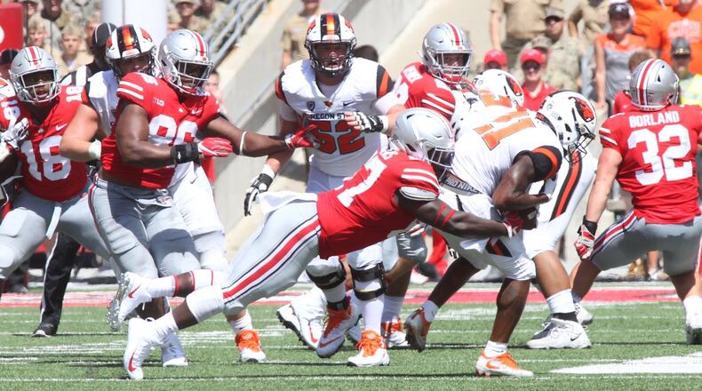 Ohio State’s Robert Landers makes a tackle against Oregon State on Saturday, Sept. 1, 2018, at Ohio Stadium in Columbus. David Jablonski/Staff
