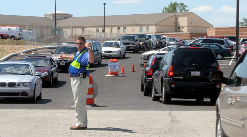 DriveOhio, the University of Cincinnati and the Unmanned Aircraft Systems Group (UAS) from Springfield are coming to Springboro to study traffic problems during peak traffic along the stretch of South Main Street in front of five local schools. Pictured is George Long, former business manager for Springboro schools, directing traffic at the high school after the first day of classes in 2005.