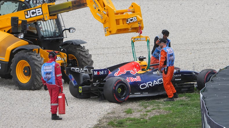 Red Bull driver Max Verstappen of the Netherlands' car is taken from the track after a crash during the qualifying session for the Australian Formula One Grand Prix at Albert Park, in Melbourne, Australia, Saturday, March 7, 2026. (AP Photo/Asanka Brendon Ratnayake)