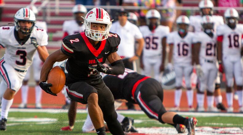 Wayne quarterback Bryan Kinley runs for yardage in the first half Friday night. Kinley rushed for 131 yards and a touchdown. Jeff Gilbert/CONTRIBUTED