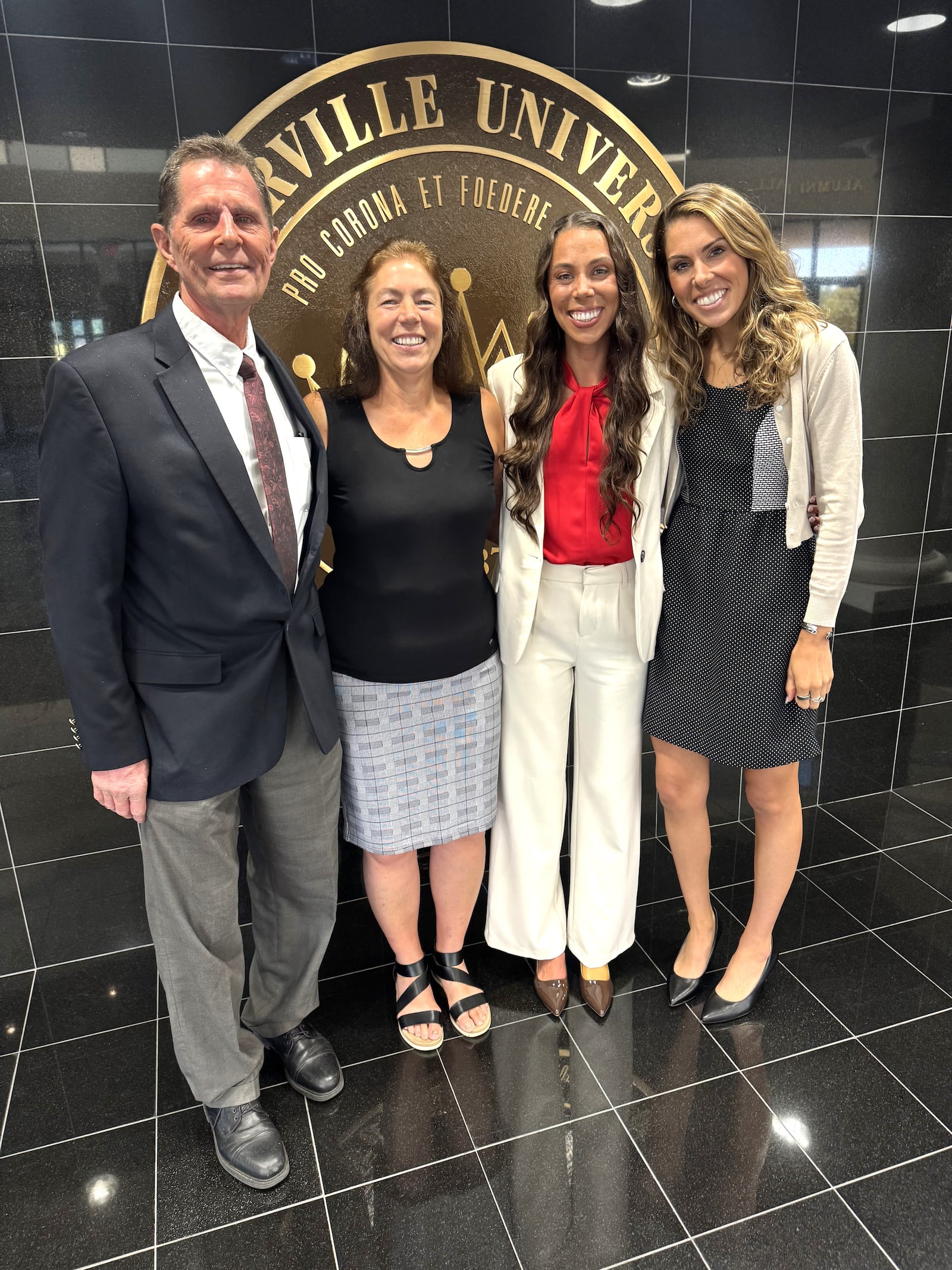Grace Norman with her family Wednesday at Cedarville University: (left to right): dad Tim, a professor at the school; mom Robin; Grace, and older sister Bethany a former Yellow Jackets cross country and track athlete who is now finishing grad school at CU to become a nurse practitioner. CONTRIBUTED PHOTO