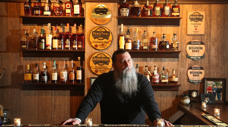 Dayton's Century Bar is located in the three-story former Dayton Power and Light building, 18 S. Jefferson St. The historic cherry wood bar, the centerpiece of the original Century Bar, has been restored and installed in the new expanded space. Century Bar is co-owned by Diane Spitzig and Joseph Head (pictured). LISA POWELL / STAFF