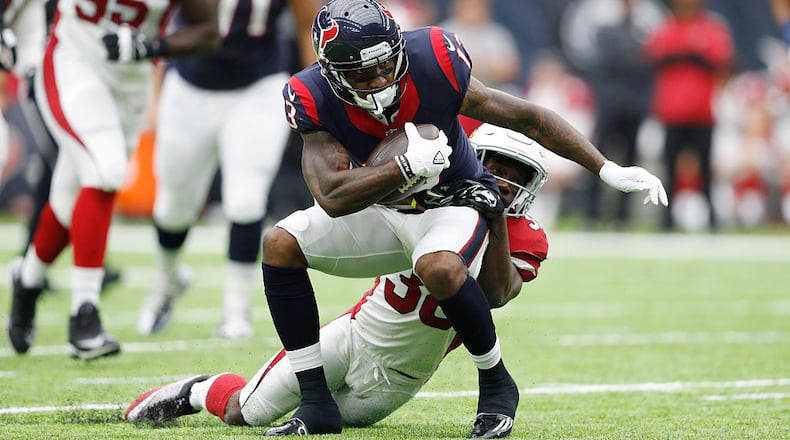 HOUSTON, TX - AUGUST 28: Braxton Miller #13 of the Houston Texans is tackled by Ronald Zamort #38 of the Arizona Cardinals after a reception in the second quarter of a preseason NFL game at NRG Stadium on August 28, 2016 in Houston, Texas. (Photo by Joe Robbins/Getty Images)