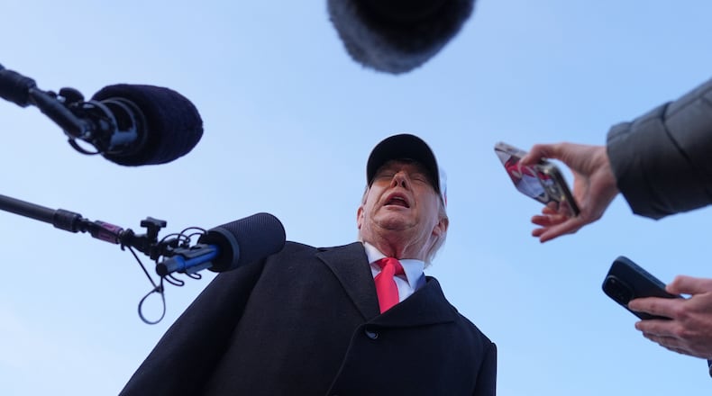 President Donald Trump speaks with reporters at Joint Base Andrews, Tuesday, Jan. 13, 2026, in Joint Base Andrews, Md. (AP Photo/Evan Vucci)