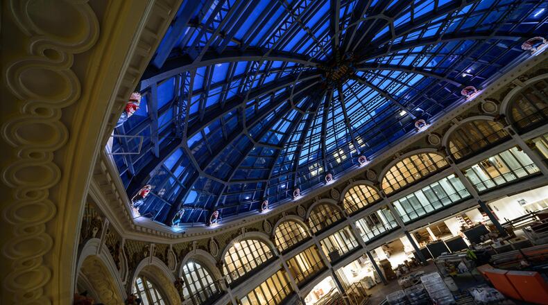 Construction continues to move closer to the finish line for Phase 1 of The Dayton Arcade redevelopment project in downtown Dayton. Up-lighting for the Rotunda Building’s 16 turkeys was recently installed as well as storefronts along the concourse. In the McCrory Building, lighting, carpeting and painting are nearing completion along with framing for the basement office pods. This space will be part of The Hub Powered by PNC, a joint venture of the University of Dayton and The Entrepreneurs Center. In The Arts Lofts at the Arcade, painting and light fixture installations continue to progress. Mantles and china cabinets, historic fixtures of the Arcade’s 4th Street apartment building are currently undergoing refinishing. The Arcade redevelopment project is a collaboration between lead developer Cross Street Partners, Model Group and McCormack Baron Salazar. For more information including leasing, visit arcadedayton.com. TOM GILLIAM / CONTRIBUTING PHOTOGRAPHER