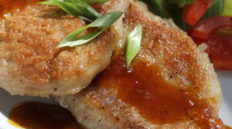 Skillet Pork Chops, with sauteed celery and apricot glaze, in a 2012 file image. (Jessica J. Trevino/Detroit Free Press/TNS)