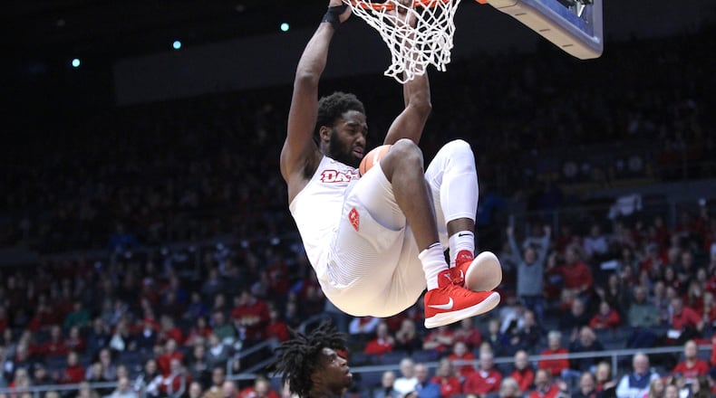Dayton’s Josh Cunningham dunks against Virginia Commonwealth on Friday, Jan. 12, 2018, at UD Arena. David Jablonski/Staff