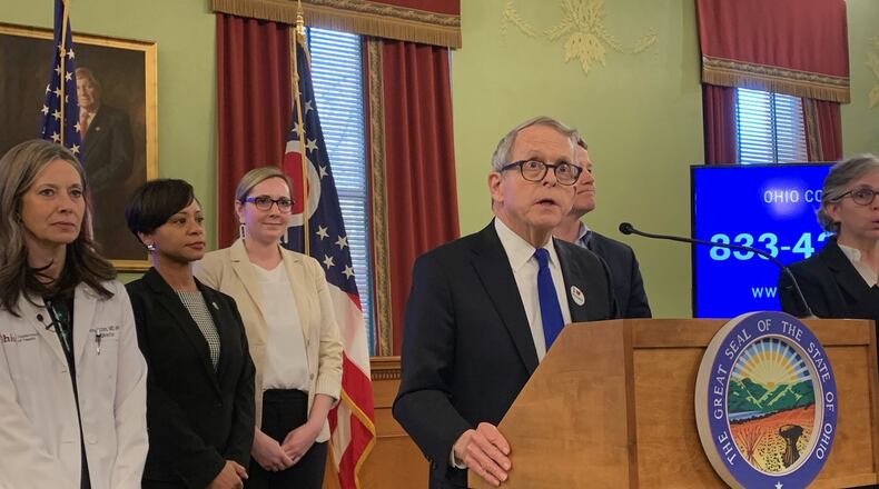 Gov. Mike DeWine and other administration leadership address the latest in the coronavirus outbreak response. LAURA BISCHOFF/STAFF