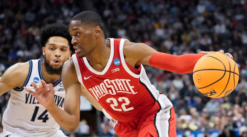 Ohio State's Malaki Branham (22) tries to get the ball past Villanova's Caleb Daniels (14) during the first half of a college basketball game in the second round of the NCAA tournament, Sunday, March 20, 2022, in Pittsburgh. (AP Photo/Keith Srakocic)