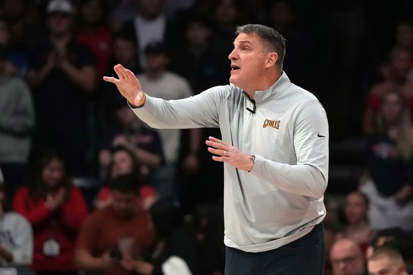 Canisius head coach Jim Christian reacts to a foul call during the first half of an NCAA college basketball game against Arizona, Monday, Nov. 4, 2024, in Tucson, Ariz. (AP Photo/Rick Scuteri)
