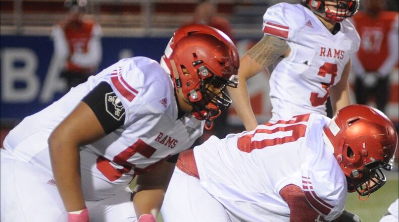 Trotwood OL Jaison Williams (left), Ian Scott (70), center Nicholas Dennis and QB Markell Stephens-Peppers. Trotwood-Madison defeated Toledo Central Catholic 16-7 in a D-III high school football state semifinal at Piqua on Friday, Nov. 24, 2017. MARC PENDLETON / STAFF