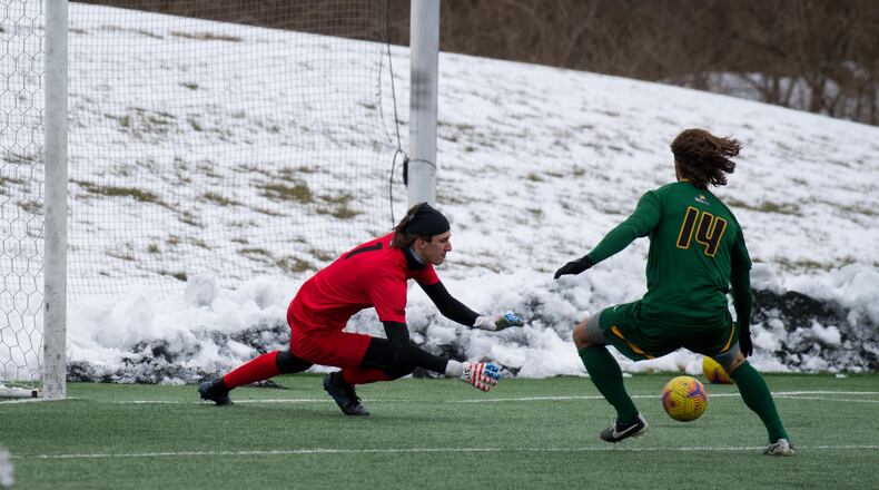 Wright State goalkeeper Isaiah Slabaugh prepares to make a save as teammate Wayne Walter looks on during Thursday's season-opening match vs. UIC. Joseph Craven/Wright State Athletics