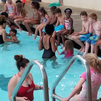 Kids participate in the "world's largest swimming lesson" at Lohrey Recreation Center. CONTRIBUTED
