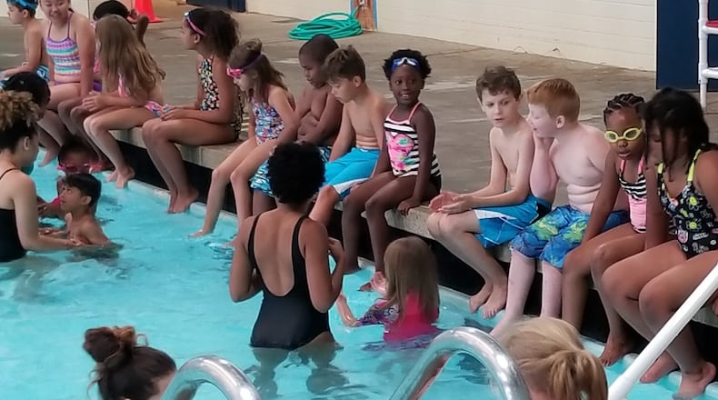 Kids participate in the "world's largest swimming lesson" at Lohrey Recreation Center. CONTRIBUTED