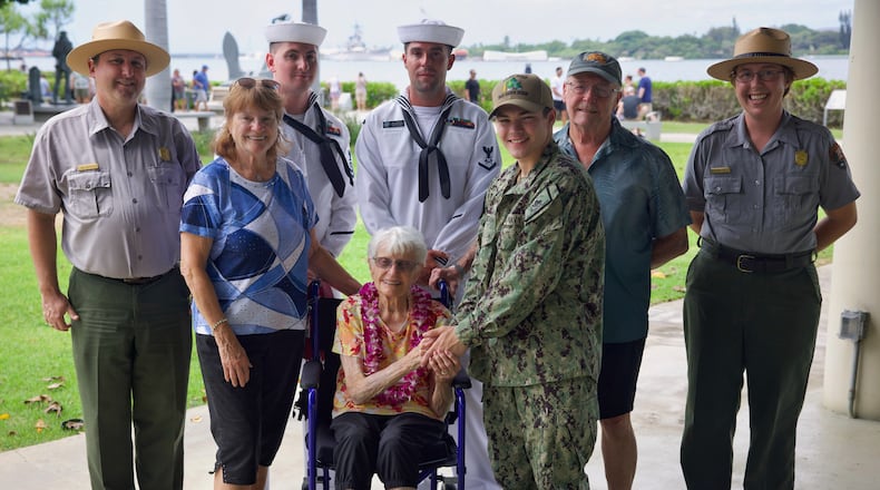 Alice Beck Darrow, a 106-year-old former Navy nurse who served during World War II, poses for a photo with family members, Navy Sailors, and National Park Service rangers. Darrow donated a bullet to the Pearl Harbor National Memorial on Sept. 18, 2025 on the patio outside the Pearl Harbor classroom. Darrow hopes the bullet will serve as a reminder of the devastation caused by the conflict and as a remembrance of her husband, whom the bullet allowed her to meet. During the attack on Pearl Harbor on December 7, 1941, Fire Controlman Dean Darrow was serving aboard the USS West Virginia (BB 48) when the ship was struck by torpedoes. Wounded by gunfire in the attack, Dean was later transported to Mare Island Naval Hospital. There, a young Navy nurse named Alice Beck tended to him as surgeons removed a bullet lodged in his heart. Against all odds, he survived. Nurse Alice and her patient Dean later married, and the couple cherished the relic throughout their lives together. (U.S. Navy photo by Kyler Hood)