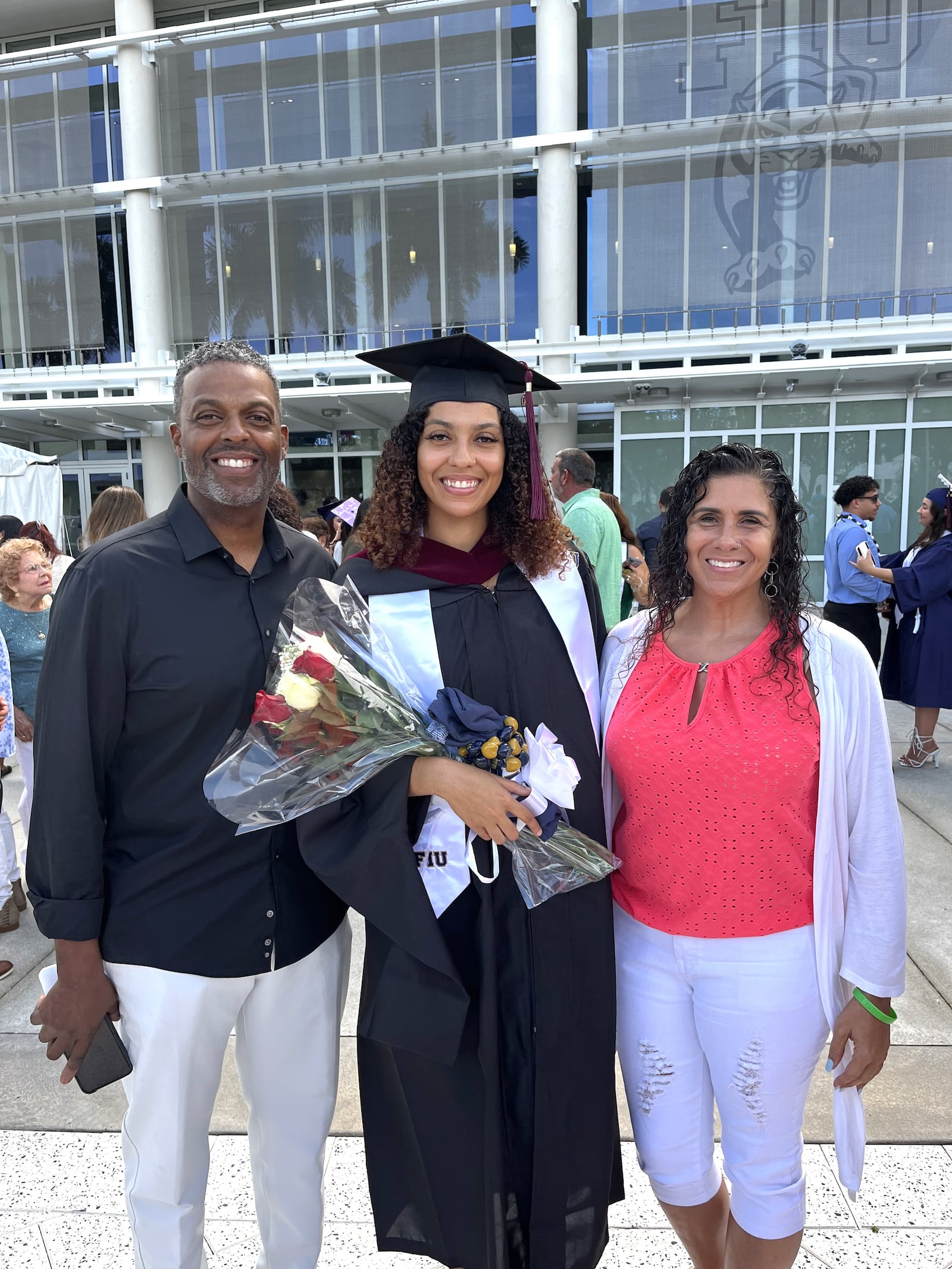 Olivia Trice with her mom, Julie, and dad, Travis, at her graduation for her master’s degree at Florida International University in Miami. CONTRIBUTED PHOTO