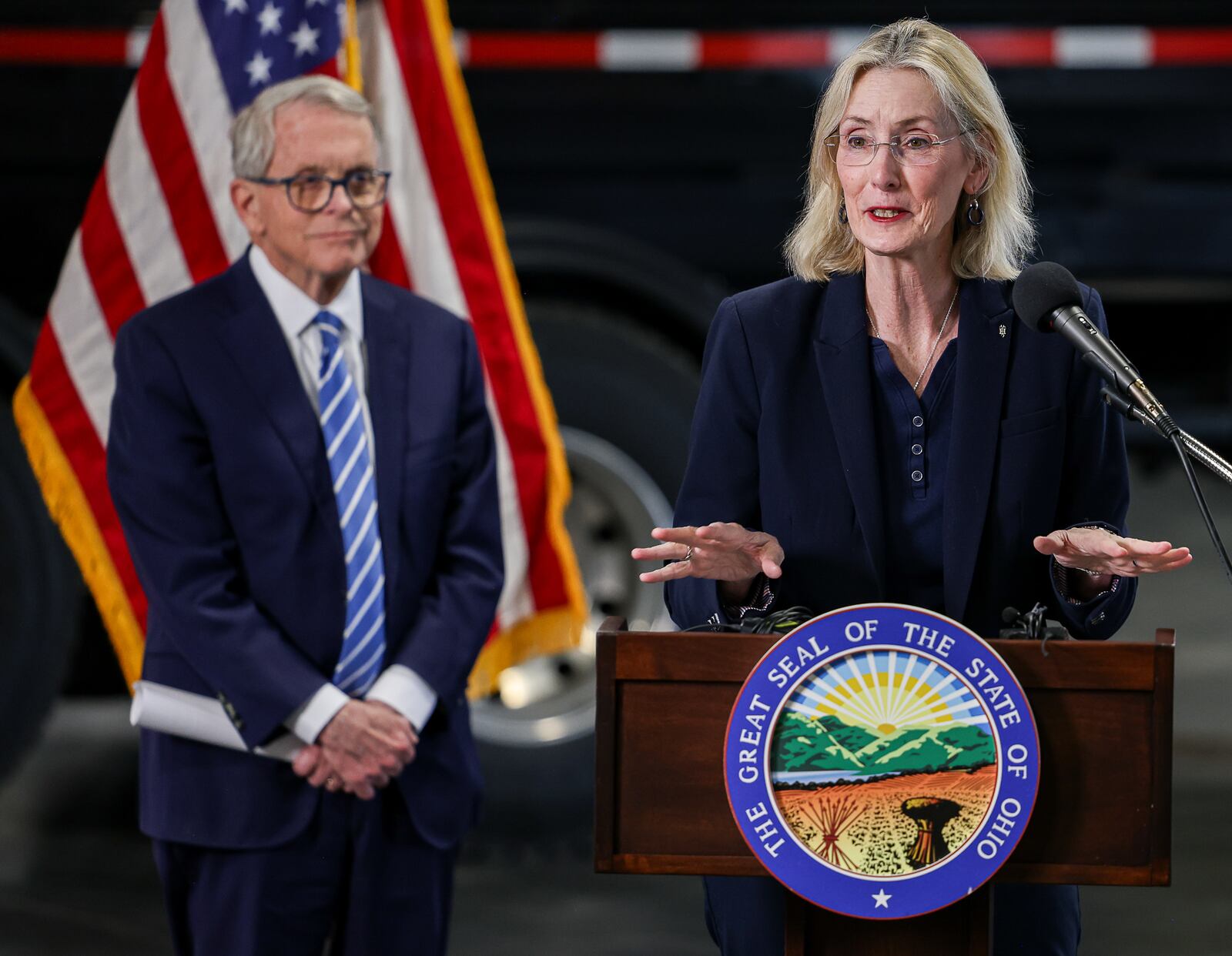 Ohio Department of Transportation Director Pamela Boratyn speaks during a news conference Thursday, April 3, 2025, while Gov. Mike DeWine listens at ODOT's facility in Moraine. BRYANT BILLING / STAFF