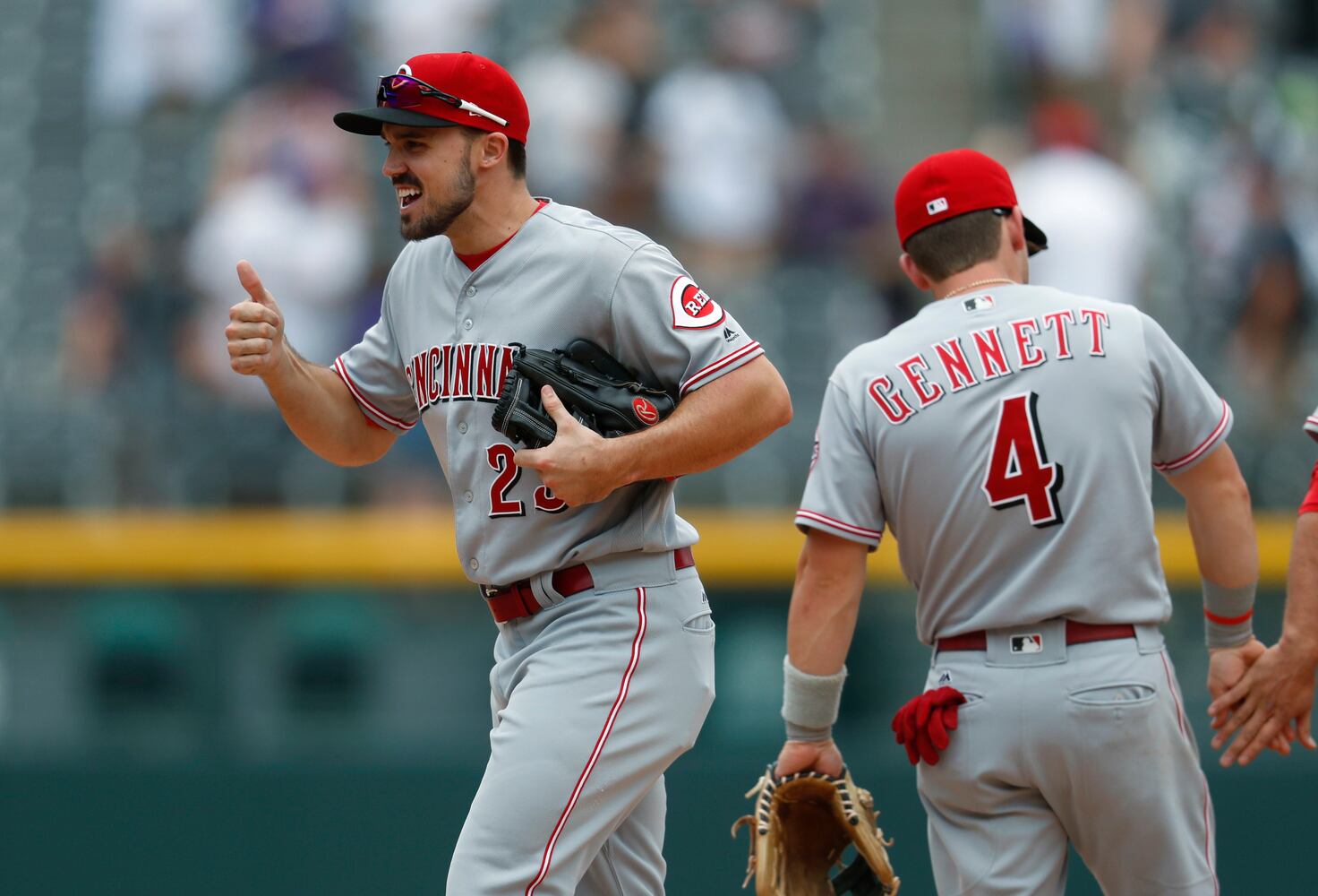 PHOTOS: Reds pile up 13 hits, beat the Rockies