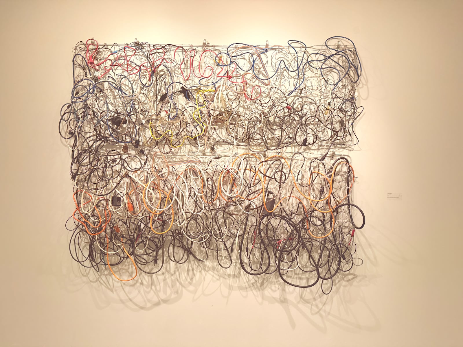 Valerie Mann, "A Little Communication Goes a Long Way", 2025, found objects, steel fencing staples. “The loopy lines are reminiscent of cursive writing,” said the artist. HANNAH KASPER/CONTRIBUTED