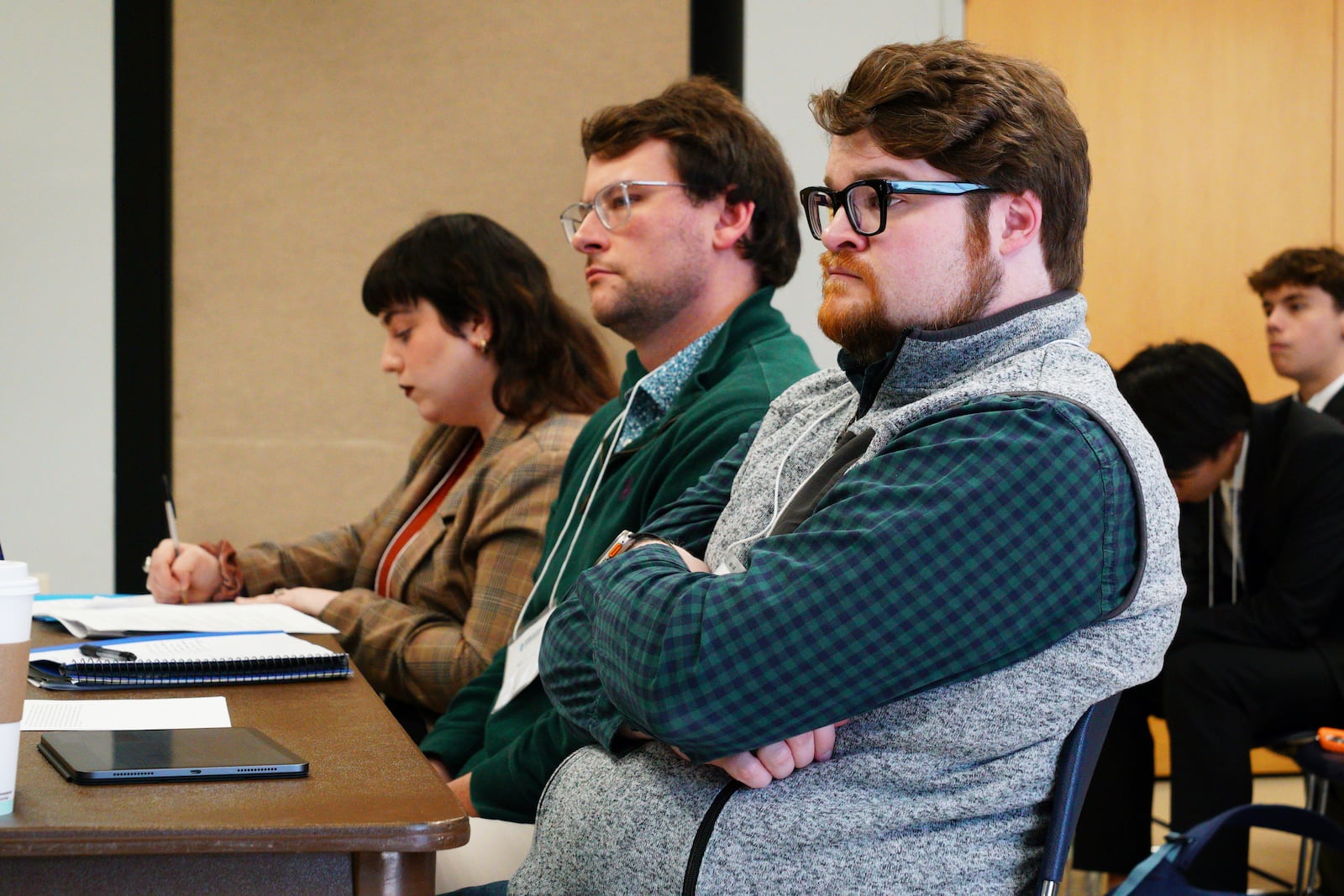 Three judges listen to questioning during a quarterfinal round of the National High School Ethics Bowl in Chapel Hill, N.C., on Sunday, April 13, 2025. (AP Photo/Allen G. Breed)
