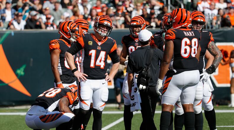 Cincinnati Bengals quarterback Andy Dalton (14) reacts in the first half of an NFL football game against the Jacksonville Jaguars, Sunday, Oct. 20, 2019, in Cincinnati. (AP Photo/Frank Victores)