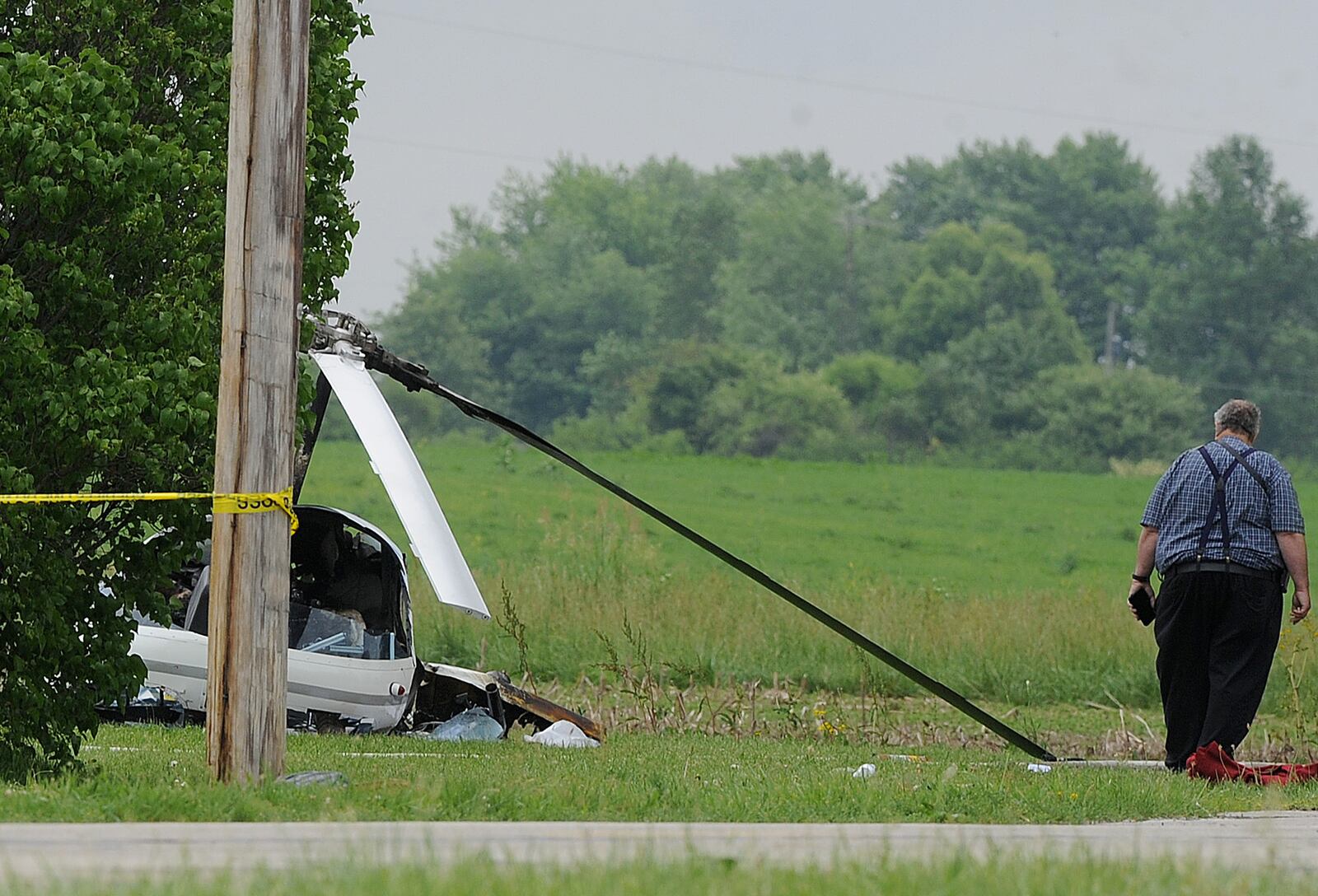 Crews were called to a fiery and deadly helicopter crash Tuesday, June 7, 2022, on Hogspath Road in Neave Twp. near Greenville in Darke County. MARSHALL GORBY\STAFF