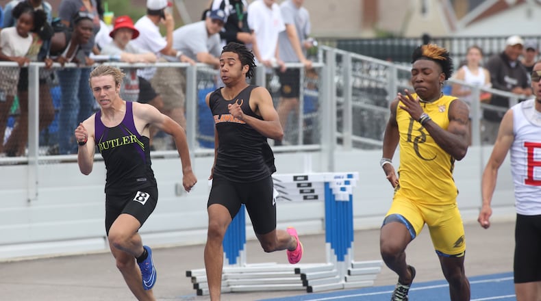 Butler's Jordan Gross, left, runs in the 200-meter dash at the Division I state track and field meet on Saturday, June 1, 2024, at Welcome Stadium in Dayton. David Jablonski/Staff