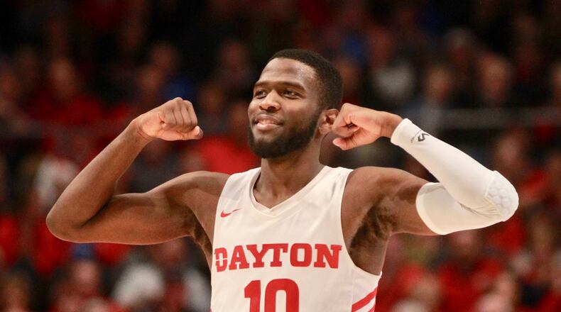 Dayton’s Jalen Crutcher flexes after a basket against Omaha on Tuesday, Nov. 19, 2019, at UD Arena. David Jablonski/Staff