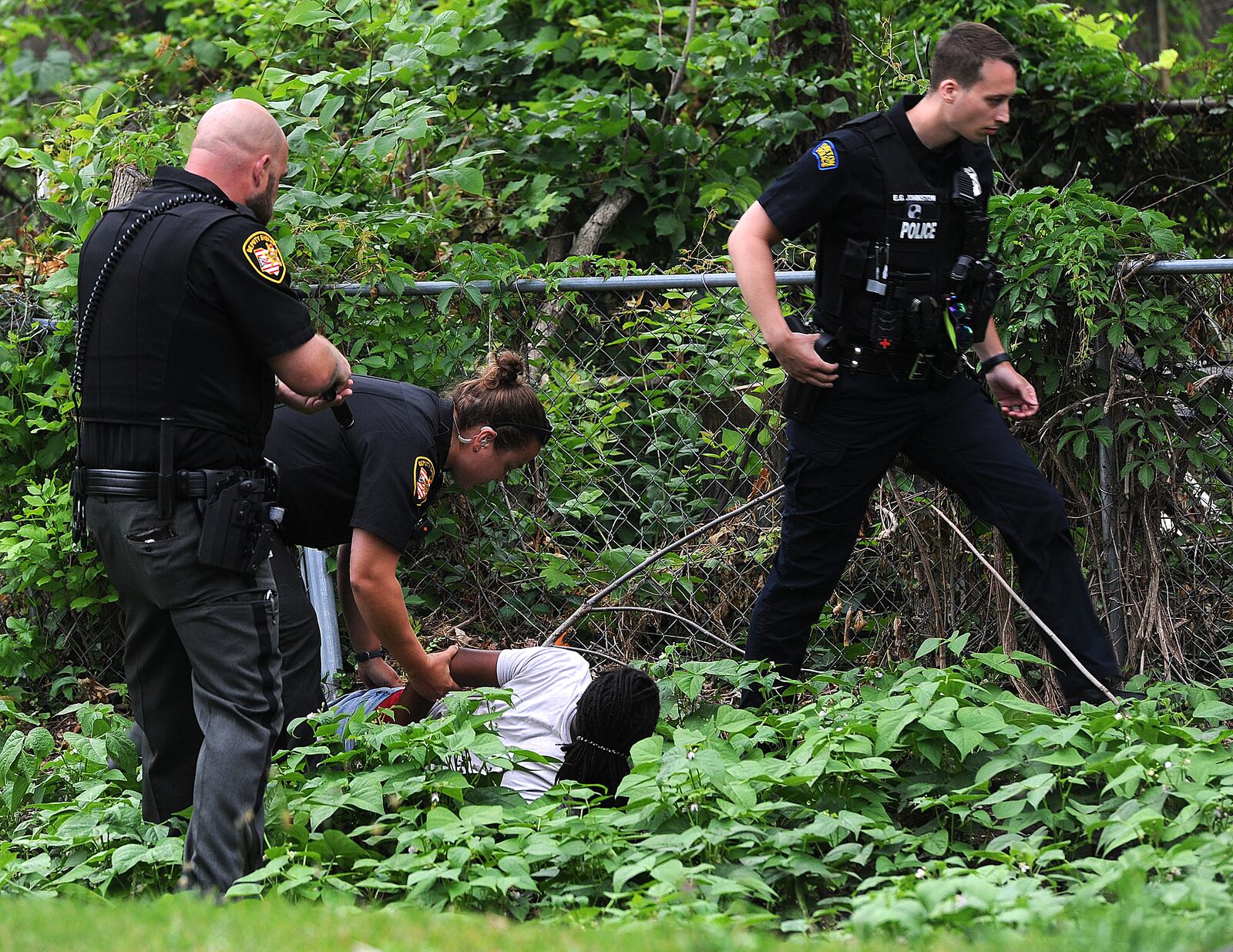Montgomery County sheriff's deputies and Dayton police held a juvenile at gun point after he was seen running through a neighborhood near North Dixie Drive with a handgun Monday morning June 19, 2023. The juvenile was apprehended hiding in a garden behind a house on Ridge Road. MARSHALL GORBY\STAFF
