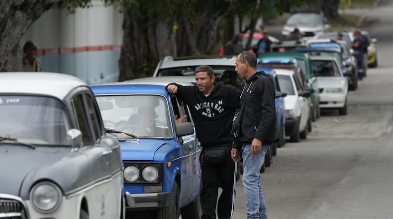 Drivers wait in a long line to enter a gas station in Havana, Cuba, Friday, Jan. 30, 2026. (AP Photo/Ramon Espinosa)