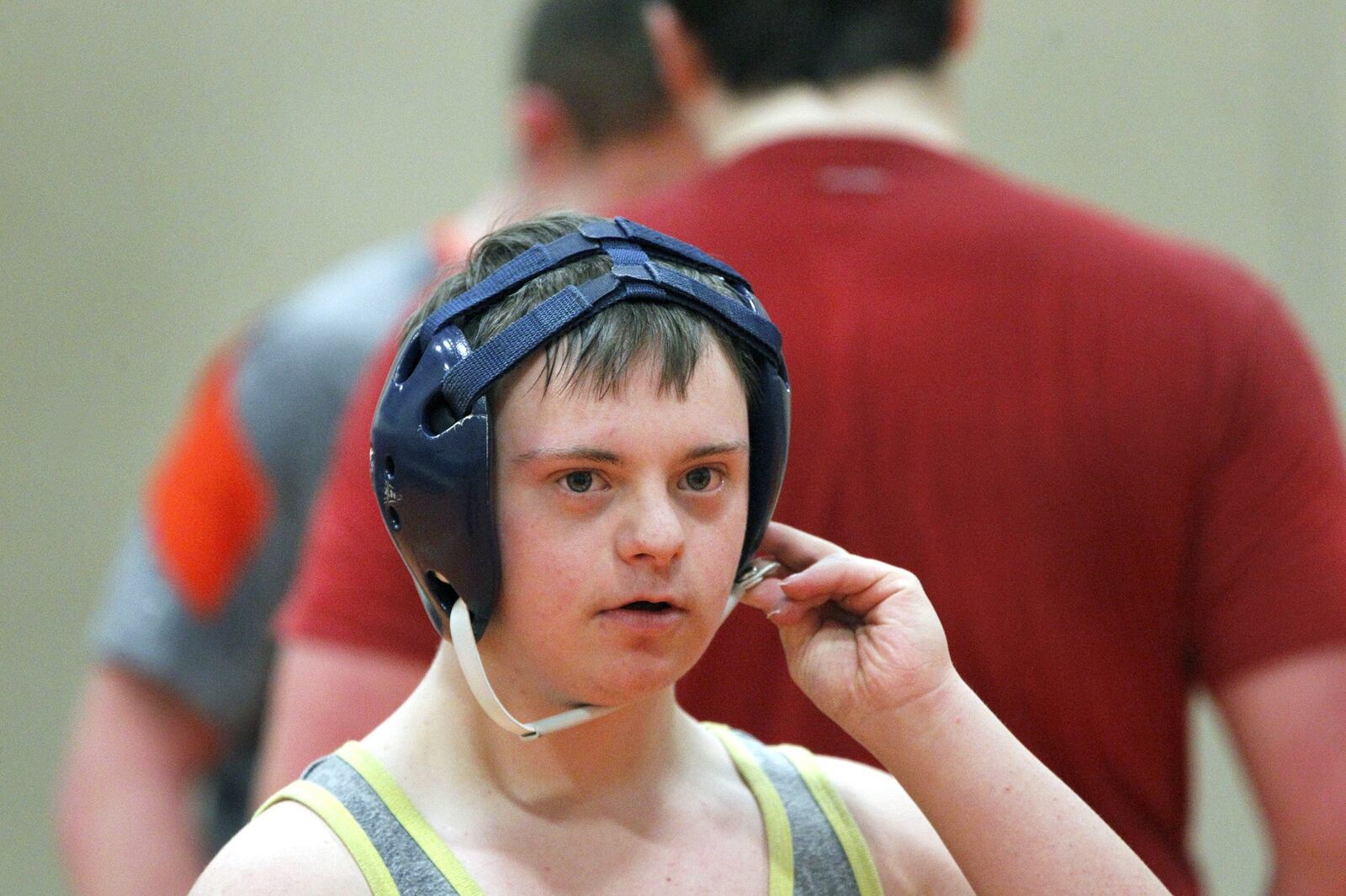 Brooks Henning, a student at National Trail High School with Down Syndrome, wrestles for his high school. LISA POWELL / STAFF