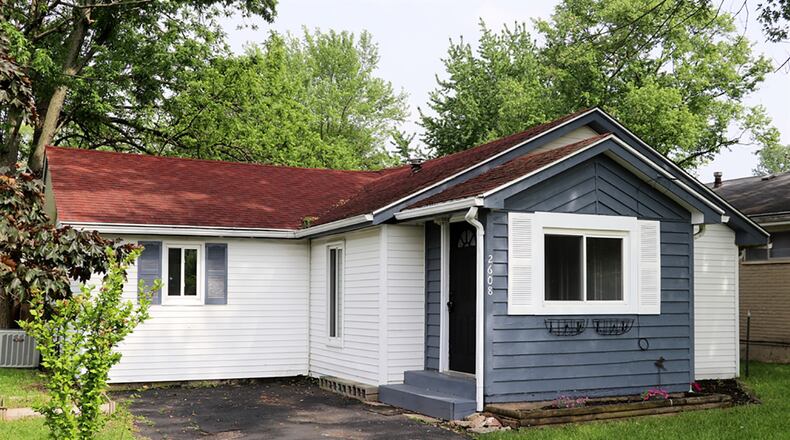 The 3-bedroom frame bungalow has about 1,010 sq. ft. of living space. The property includes a paved front driveway, a private back yard and a 2-car, detached garage with alley access. CONTRIBUTED PHOTO BY KATHY TYLER