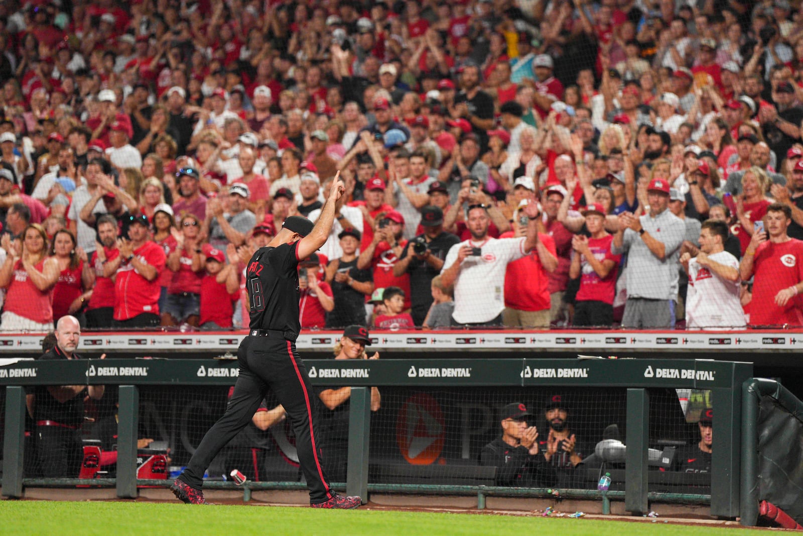 Cincinnati Reds pitcher Nick Martinez (28) gestures to the crowd after a pitching change during the ninth inning of a baseball game against the San Diego Padres, Friday, June 27, 2025, in Cincinnati. (AP Photo/Jeff Dean)