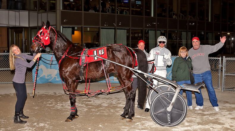 Lou’s Delight in the winner’s circle following his victory in the sixth race at Dayton Raceway on Friday night. From left: groom Bryce Gulbranson, Jeff Arvin, driver Tyler Smith and Reggie and Jack Froschauer, who own Lou. Brad Conrad/Conrad Photos