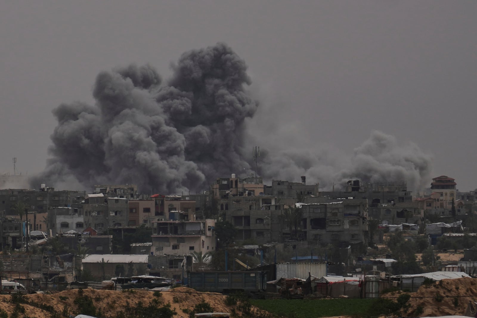 Smoke rises to the sky following an Israeli bombardment in Khan Younis, Gaza Strip, Thursday, April 24, 2025. (AP Photo/Abdel Kareem Hana)